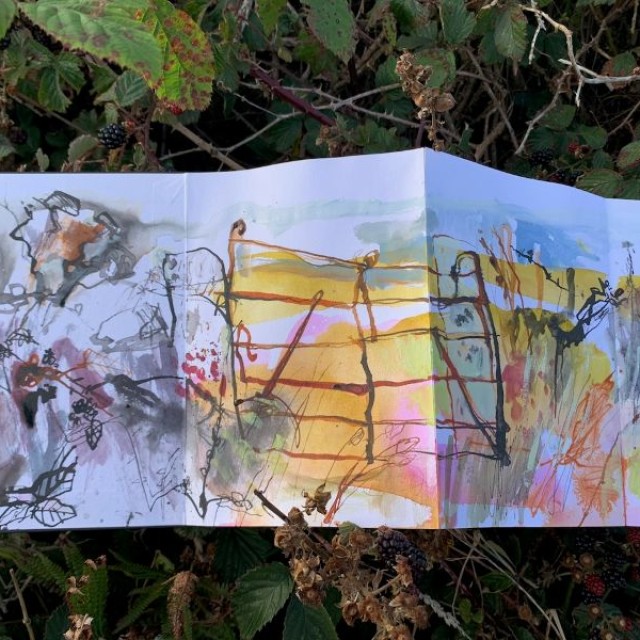 landscape painting laid on bush